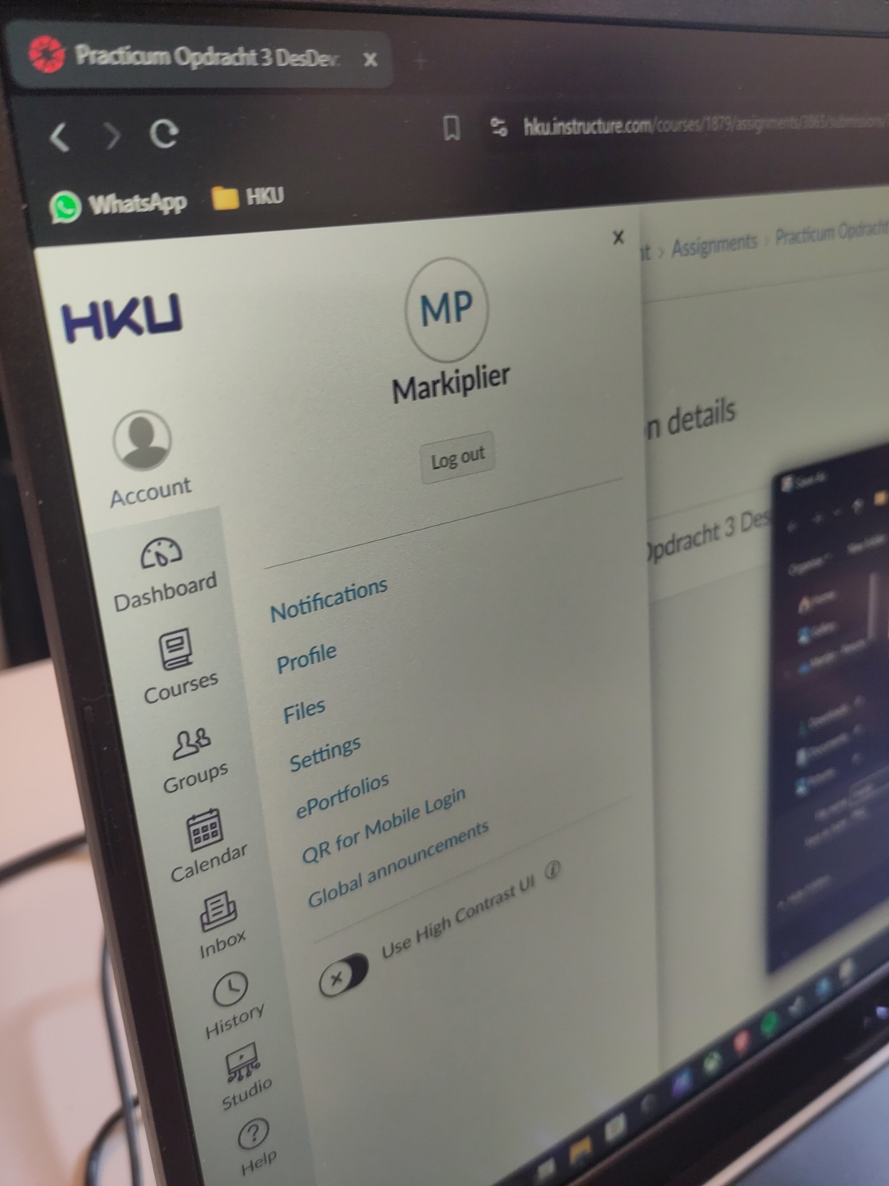 A photo of a laptop showing a HKU student page with Markiplier logged in