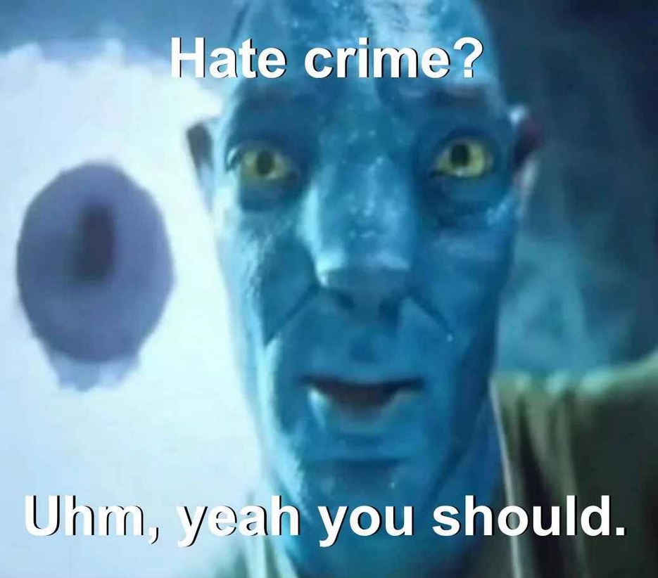 A brilliant image of a blue alien from Avatar 2 the World of Water 2022 stating the humorous quote Hate crime? Uhm, yeah you should