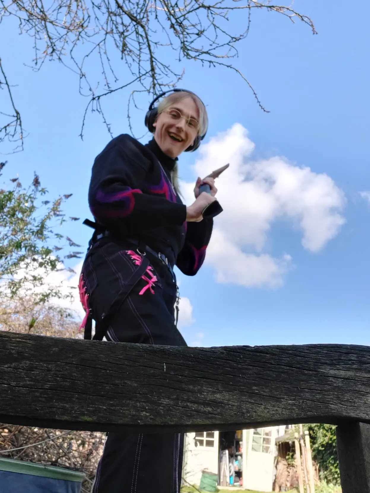 Me holding an axe at the camera smiling
(Dont worry i know how to safely use an axe, ive been trained for this)