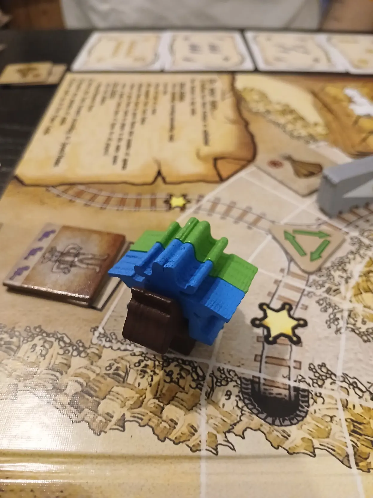 Two cowboy meeples fitted on the same.horse meeple