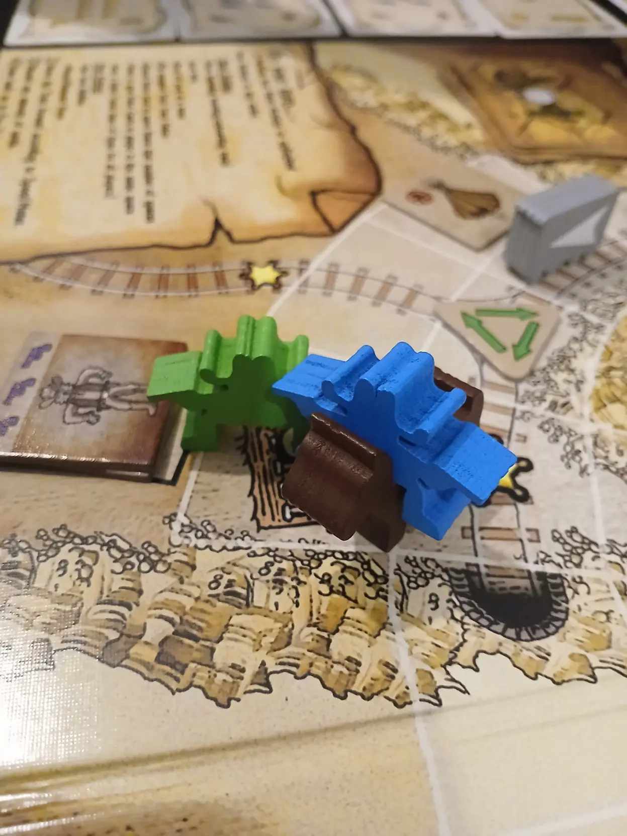 Said cowboy meeple on a horse meeple