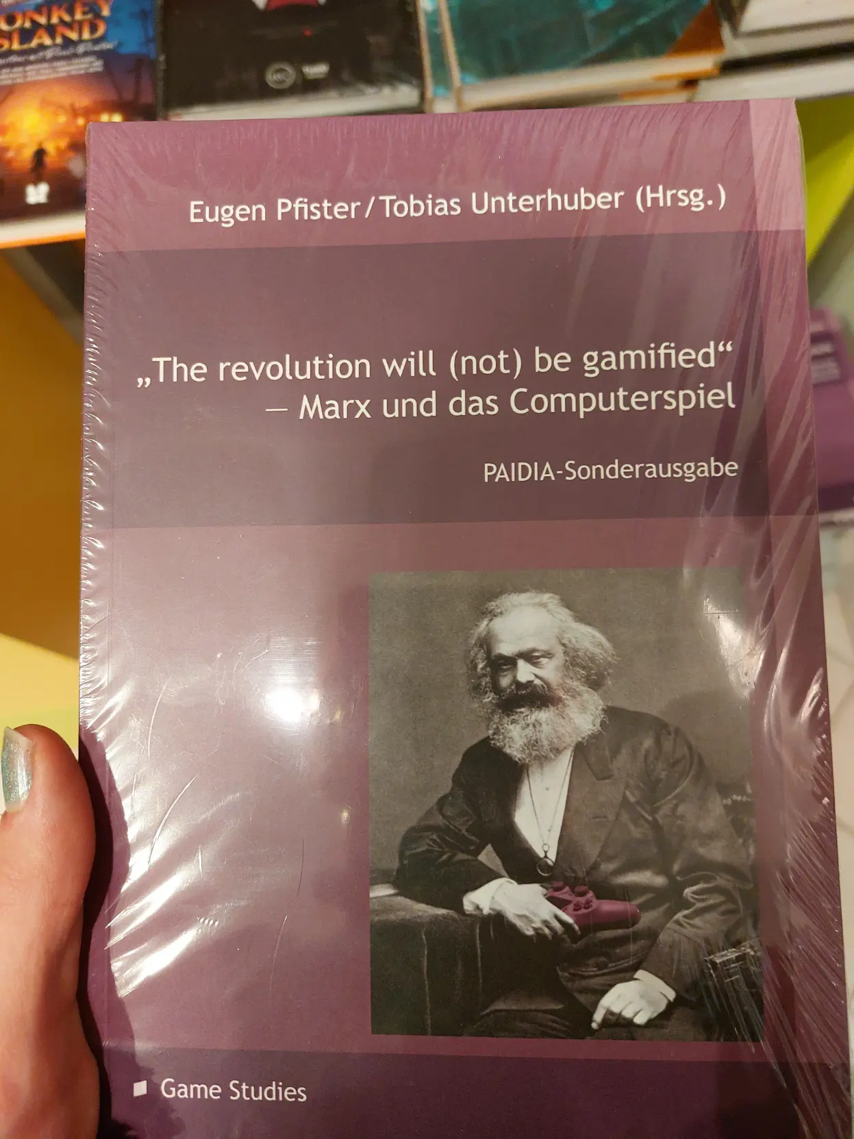 Photo of a book titled "The revolution will (not) be gamified - Marx und das Computerspiel"